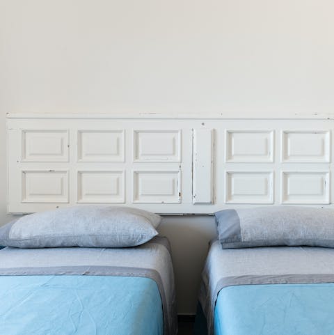 Get some rest in the bedroom with its vintage door bedhead