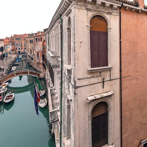 Admire the view of the canal below from the balcony