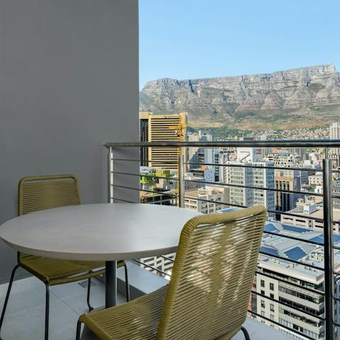Enjoy a glass of South African wine on one of the private balconies