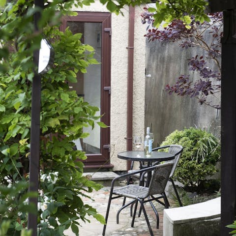 Spend late summer evenings enjoying the leafy privacy of the garden