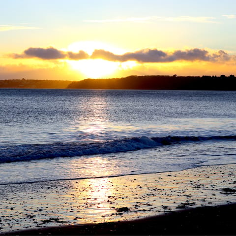 Sink your toes in the sand at Paignton Beach, a ten-minute walk away