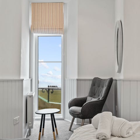 Curl up on the window-side armchair with a mug of coffee while admiring the sea views each morning