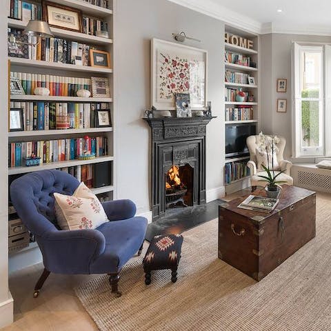 Pluck a book off the shelf and enjoy reading by the crackling fire