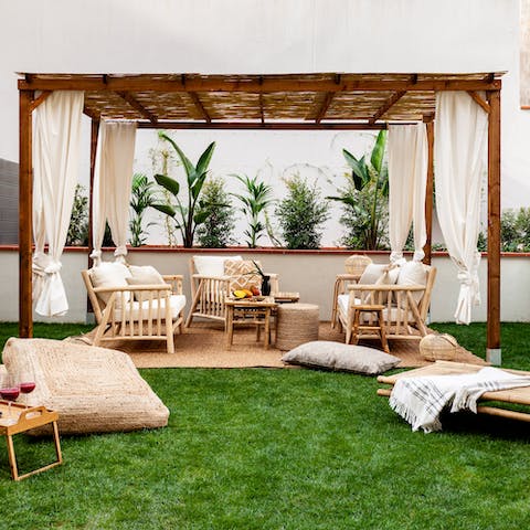 Relax under the shade of the private terrace's pergola or catch some rays on the sun loungers