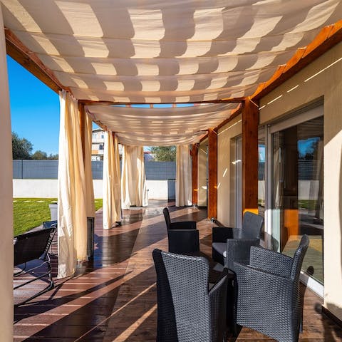 Catch the golden hour while relaxing under one of two shaded terraces