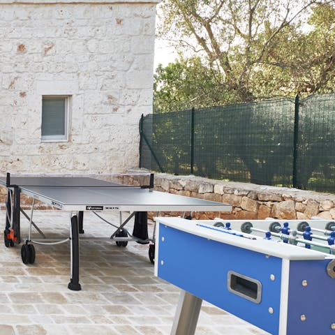 Take a break from the beating sun and challenge your group to a table tennis session 