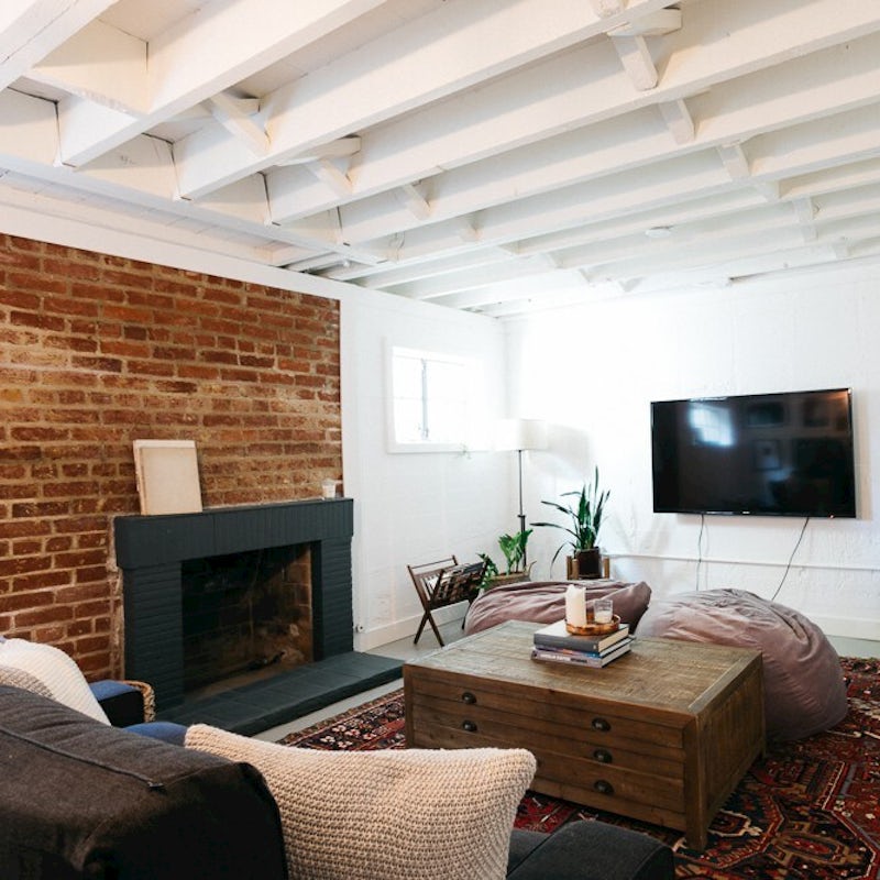 Cuddle up by the open fireplace in the TV room