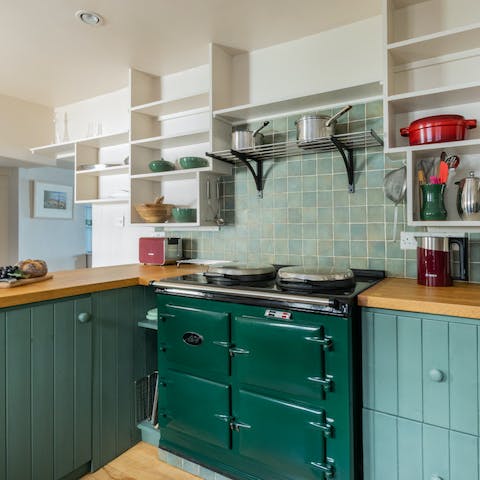 Whip up a delicious breakfast on the forest green Aga