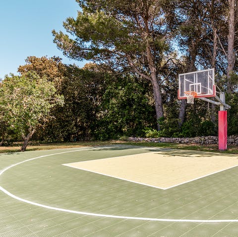 Enjoy a friendly game of basketball on the private court