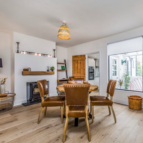 Come together in a cosy dining room while your dog lies by the log burner