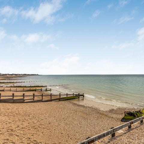 Walk along the pebbles at Felpham Beach, moments away from this home