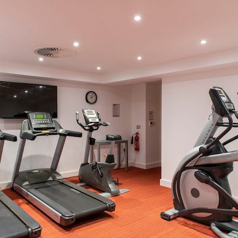 Head downstairs to the building's gym and squeeze in a quick workout