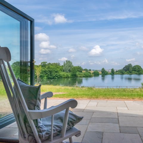 Open up the bi-folding doors and enjoy a good book while looking out across the lake