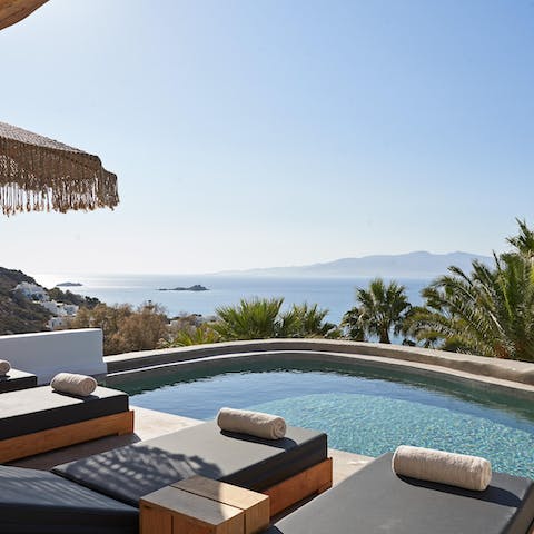 Admire the sweeping view from the sun lounger or private pool