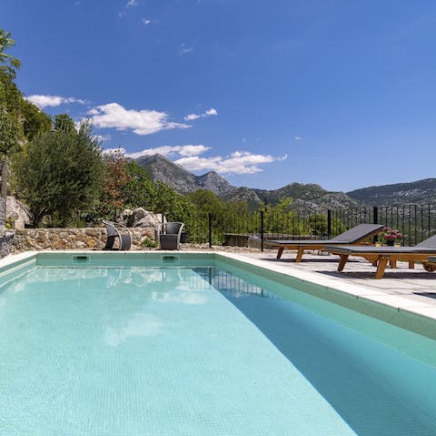 Plunge into the hydro-massage pool overlooking the mountains