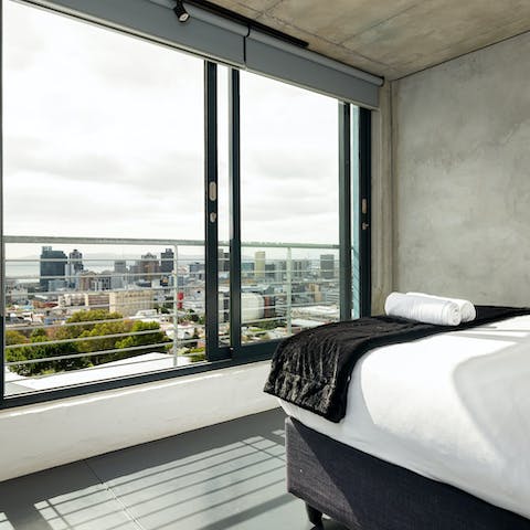 Wake up in your sleek bedroom to stunning views over Cape Town