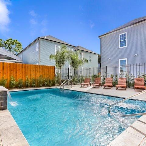 Cool off under the fountain in the home's very own swimming pool