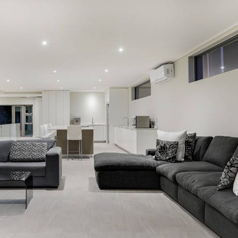 Let the group spread out across two huge sofas in the living room