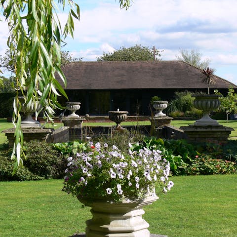 Explore the surrounding eight acres of perfectly manicured gardens