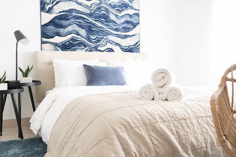 Fall into a deep sleep in the soothing blue and beige bedroom