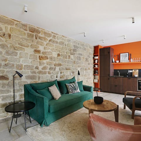 Make yourself at home in the rustic living space after a day of exploring the Place de la Bastille district