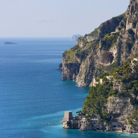 Admire the enclave of Positano from your private balcony
