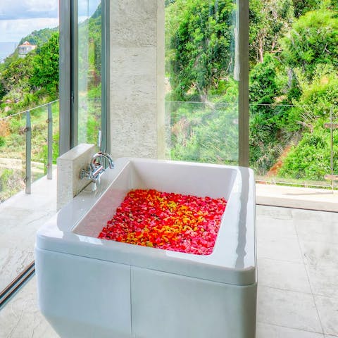 Bathe in blissful serenity from the bathtub perfectly positioned to take in the surrounding natural beauty