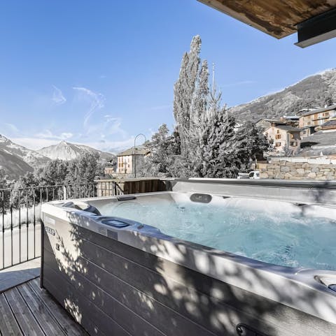 Relax with a glass of wine in the private hot tub