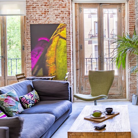 Kick back in the bright living room with a glass of Spanish wine after a day of sightseeing