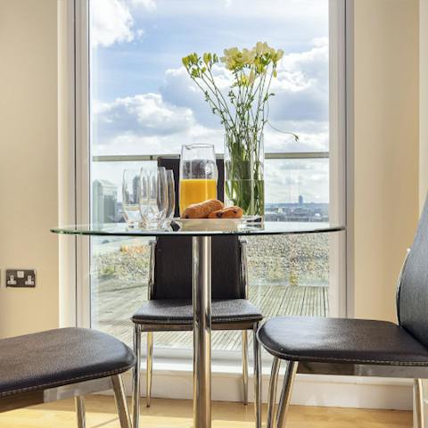 Plan the day's agenda over breakfast at the window-side dining table