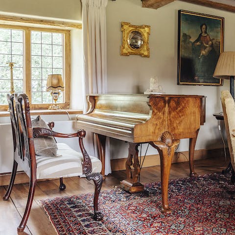 A separate music room with a grand piano