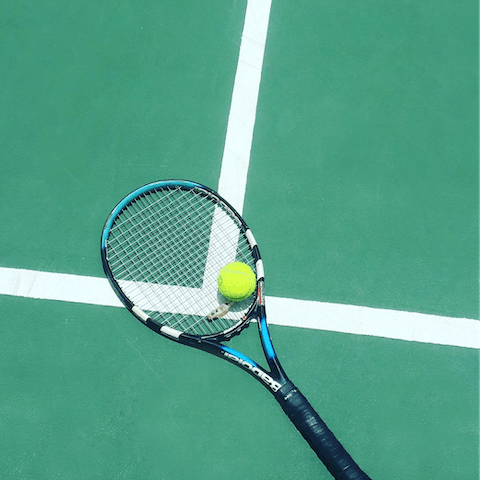 Practise your backhand on the on-site tennis court