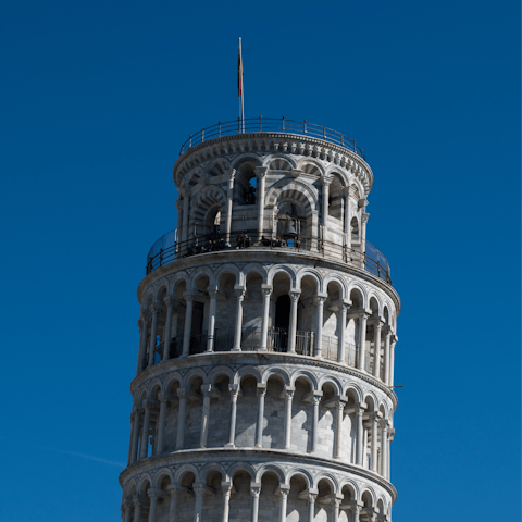 Drive into Pisa and visit the city's iconic leaning tower
