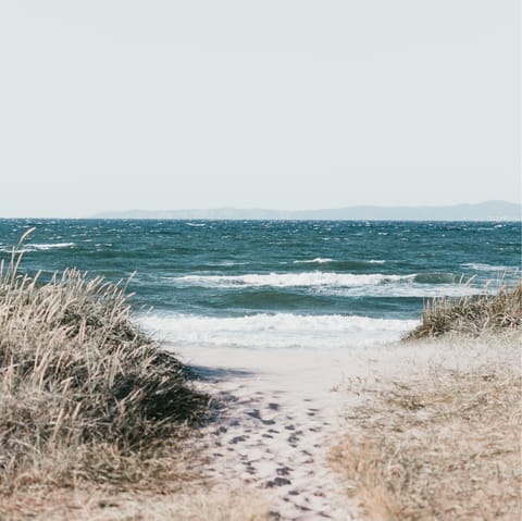 Pack a picnic and head down to Lyngby Beach, a five-minute walk from home