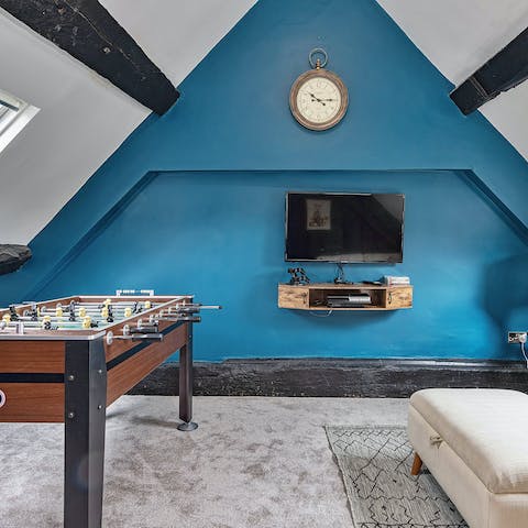 Play table football or ping pong, with fun pastimes dotted about this home