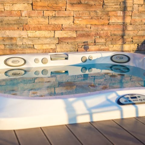 Let the jets and bubbles of the hot tub massage your skin