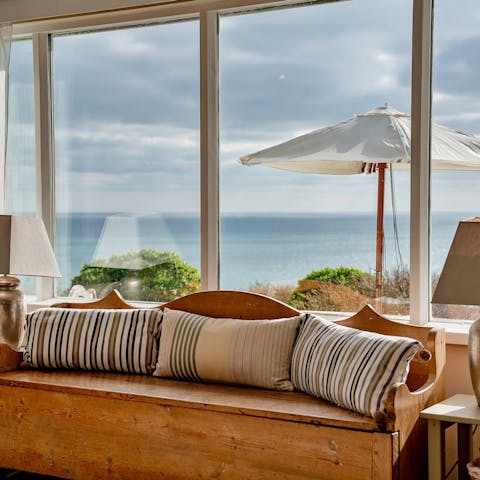 See the reflections over the sea from the living room