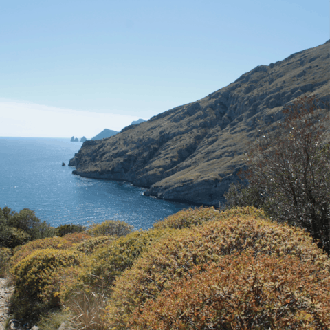 Explore the evocative coastline of Massa Lubrense, with Capri in the distance