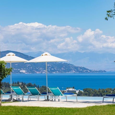 Drink in those stunning sea views from a poolside sun lounger