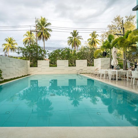 Take a refreshing dip in the rooftop infinity pool