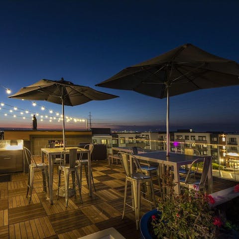 Gather together for a sundowner and a barbecue on the communal rooftop terrace