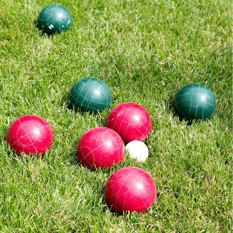 Play a game of bocce ball on the shared courts