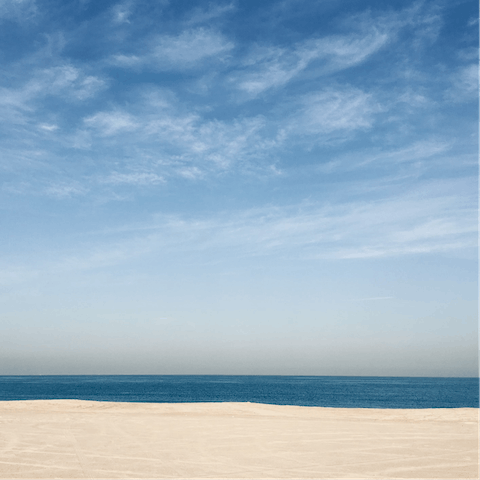 Sink your toes into the sands of JBR beach, a few minutes' walk from your apartment 