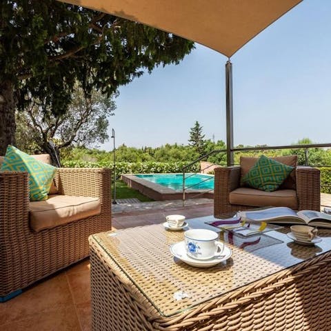 Relax in the sun or lounge in the shade on the poolside terrace