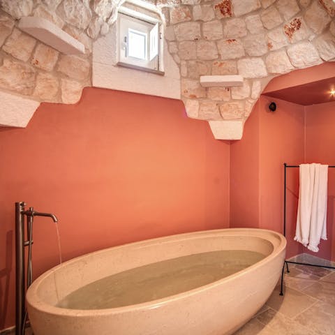 Soak all night in the freestanding tub in the master bedroom, with a glass of wine in hand