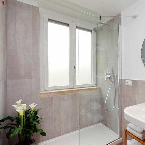Start your mornings with a luxurious soak beneath the rainfall shower