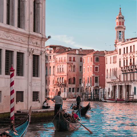 Hop on a gondola or water taxi to explore the Venice canals