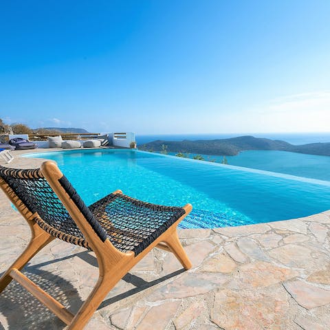 Sit with your feet in the pool while you gaze out at absolutely breathtaking sea views