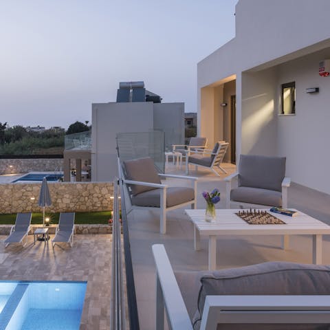 Retreat to the balcony for a sundowner and enjoy those last moments of the day in style