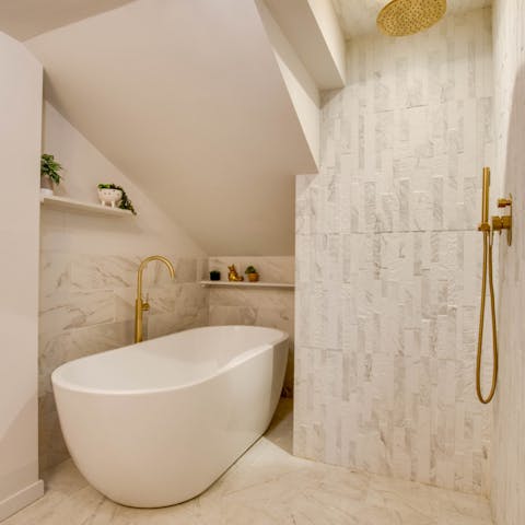 Pamper yourself in the spa-like bathroom with a soak in the freestanding bath tub